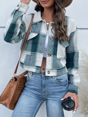 Green plaid shacket with patch pockets and button closure, styled with jeans.