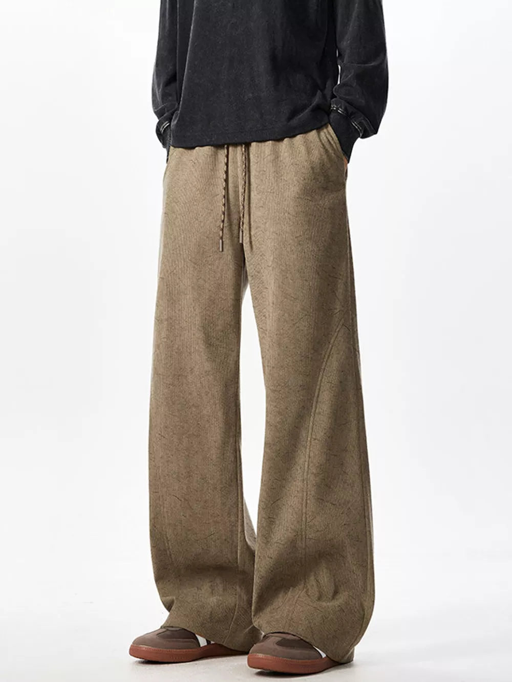 Textured wide leg drawstring sweatpants in khaki with a relaxed fit and adjustable waist.