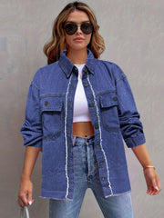 Frayed edge denim overshirt in medium blue cotton with button front and chest pockets.