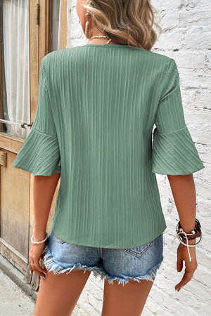 Sage green ribbed V-neck blouse with pleated bell sleeves