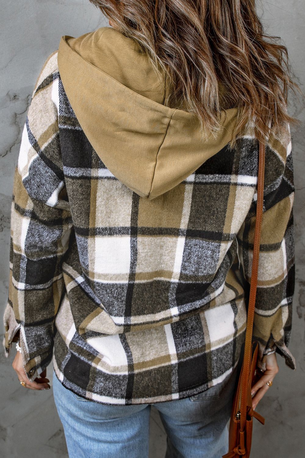 Plaid hooded shacket in tan, black, and white. Relaxed fit, casual outerwear.