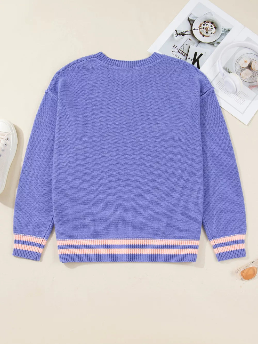 Plus size lavender knit sweater with pink striped cuffs and hem.