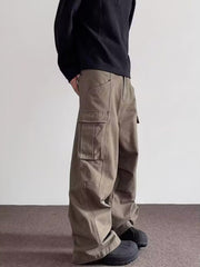 Men's brown cargo sweatpants with baggy fit and large side pockets.