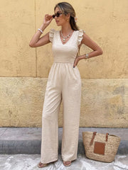 Beige V-neck ruffled sleeve wide-leg romper with textured fabric.
