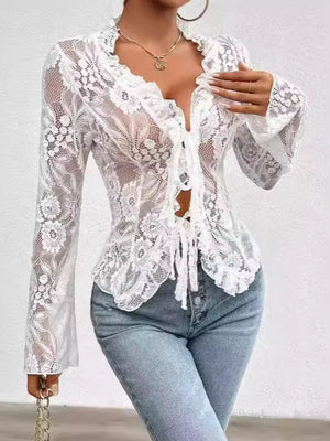White lace tie-front blouse with floral pattern and ruffled neckline.