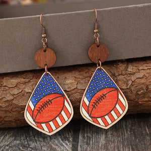 Patriotic football woodcut dangle earrings with American flag design.