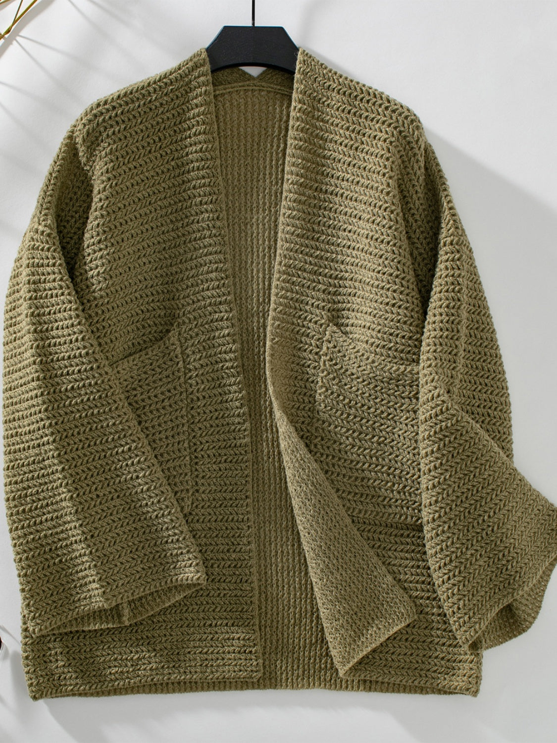 Moss chunky knit open front cardigan with pockets and a textured stitch pattern.