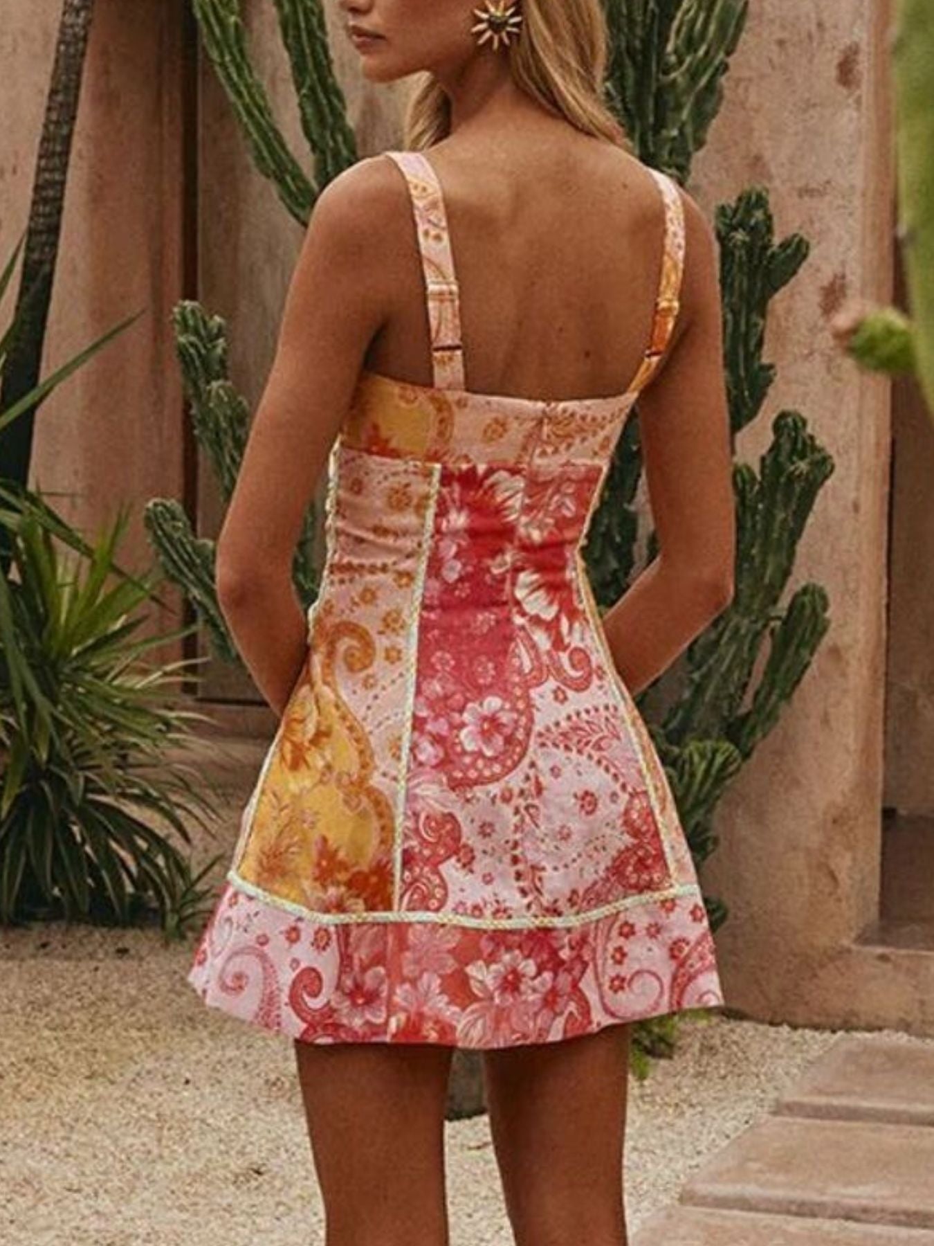 Floral mini dress with sweetheart neckline and patchwork print.