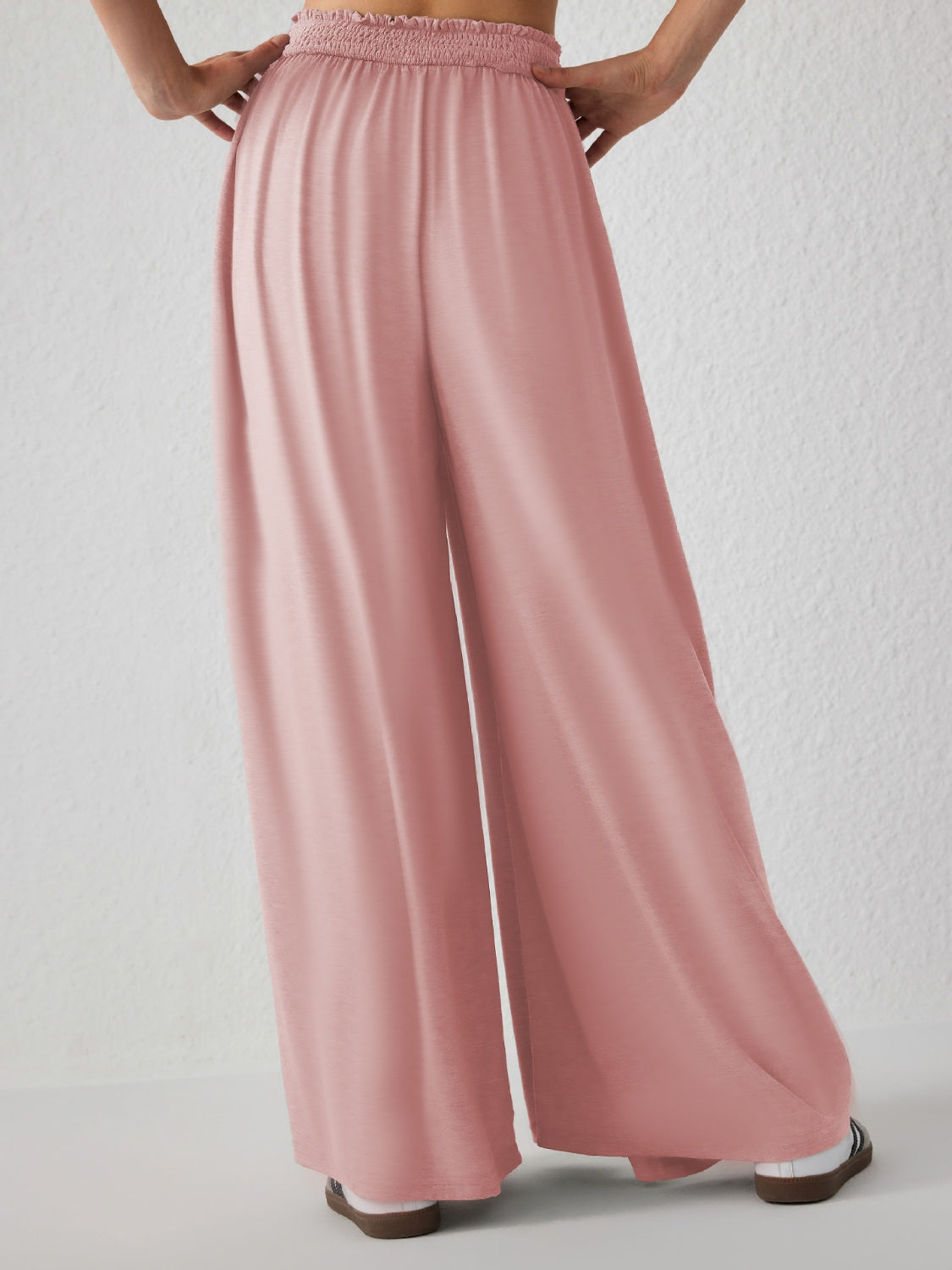 Drape-front wide-leg jersey trousers in watermelon pink with smocked waistband.