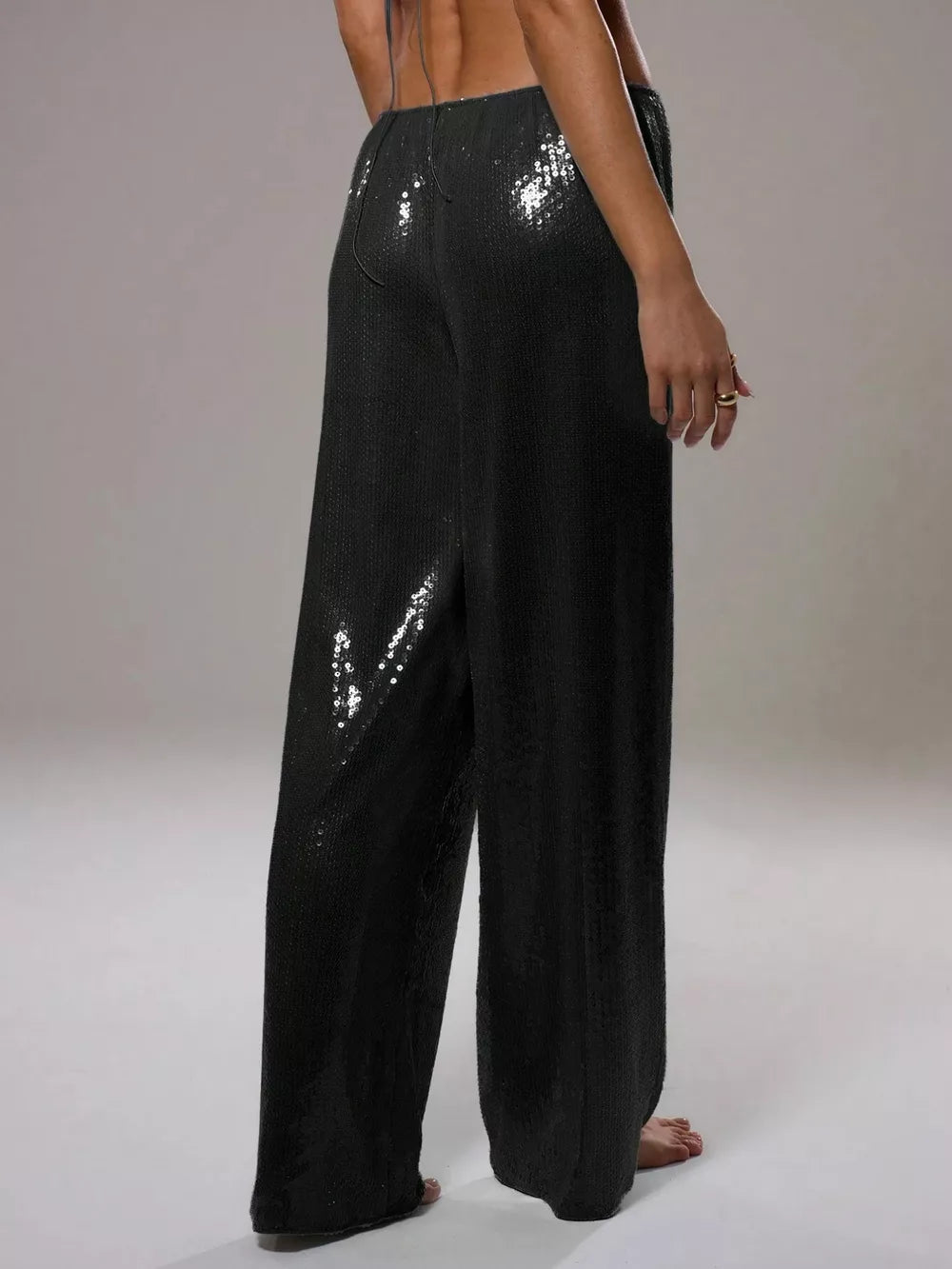 Black sequin wide leg pants with drawstring waist.