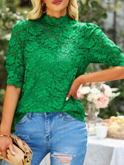 Green lace short sleeve blouse with mock neck and puff sleeves.