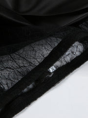Black midi skirt with sheer lace panel detail and satin fabric.