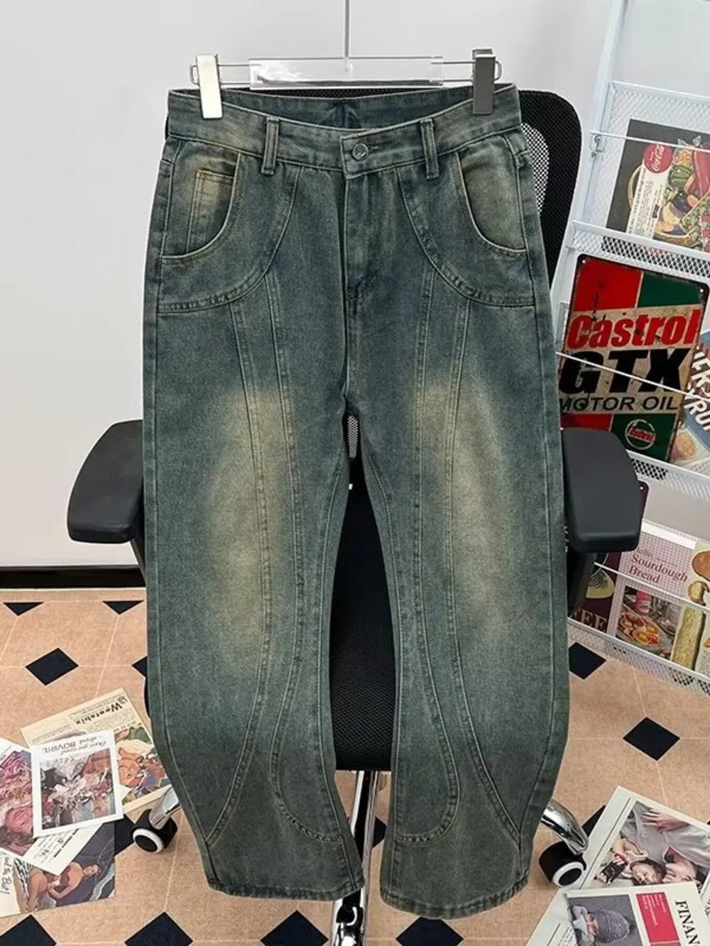 Men's vintage-inspired flared jeans in a faded blue denim with a low-tone wash.