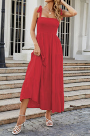 Red tiered ruffle smocked bodice maxi dress with tie straps.