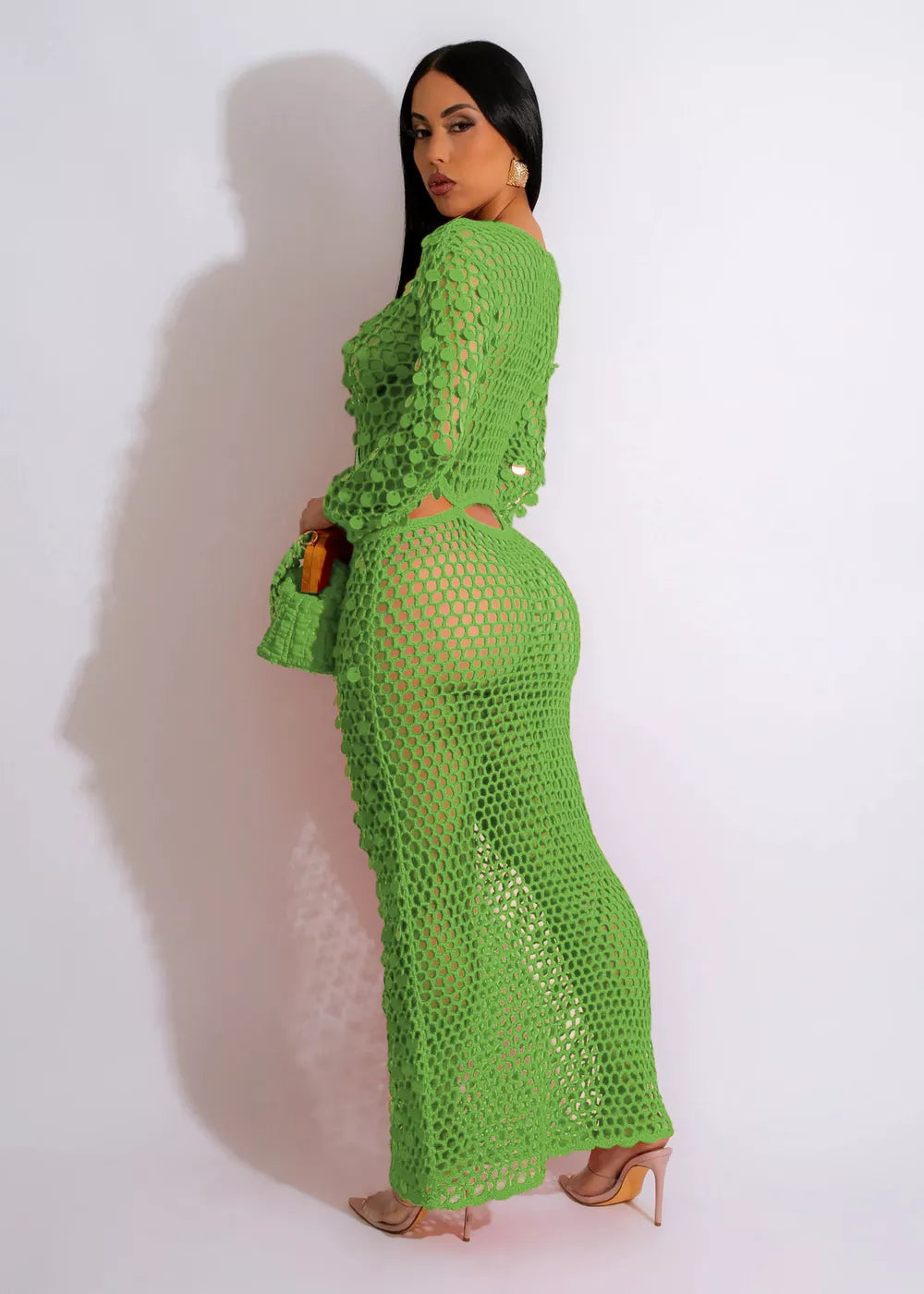 Green mesh cutout maxi dress with long sleeves and bodycon fit.