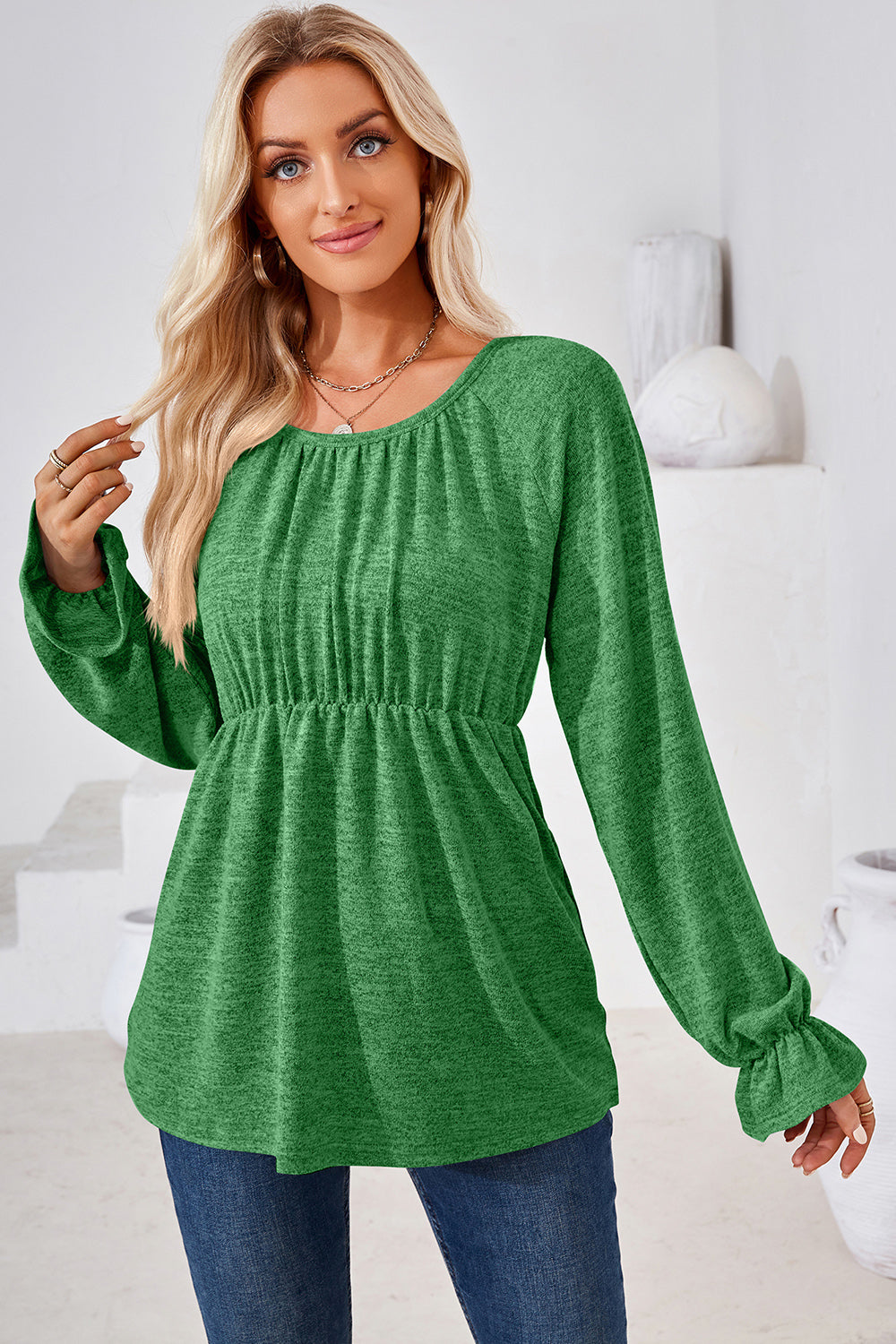 Green marled long sleeve peasant blouse with cinched waist and ruffled cuffs.