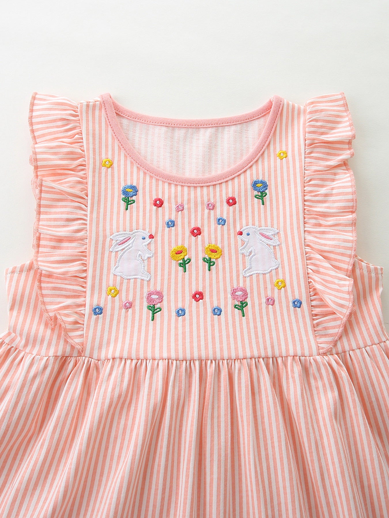 Embroidered bunny ruffle sleeve dress in pink and white stripes with floral embroidery.
