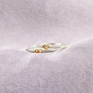 Silver rings with heart and infinity charms, accented with small crystals