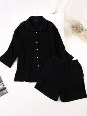 Black gauze cotton resort shirt and shorts set with button front and elastic waist shorts.