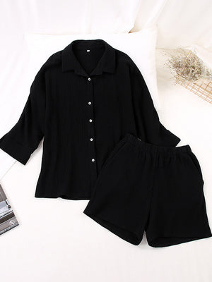 Black gauze cotton resort shirt and shorts set with button front and elastic waist shorts.