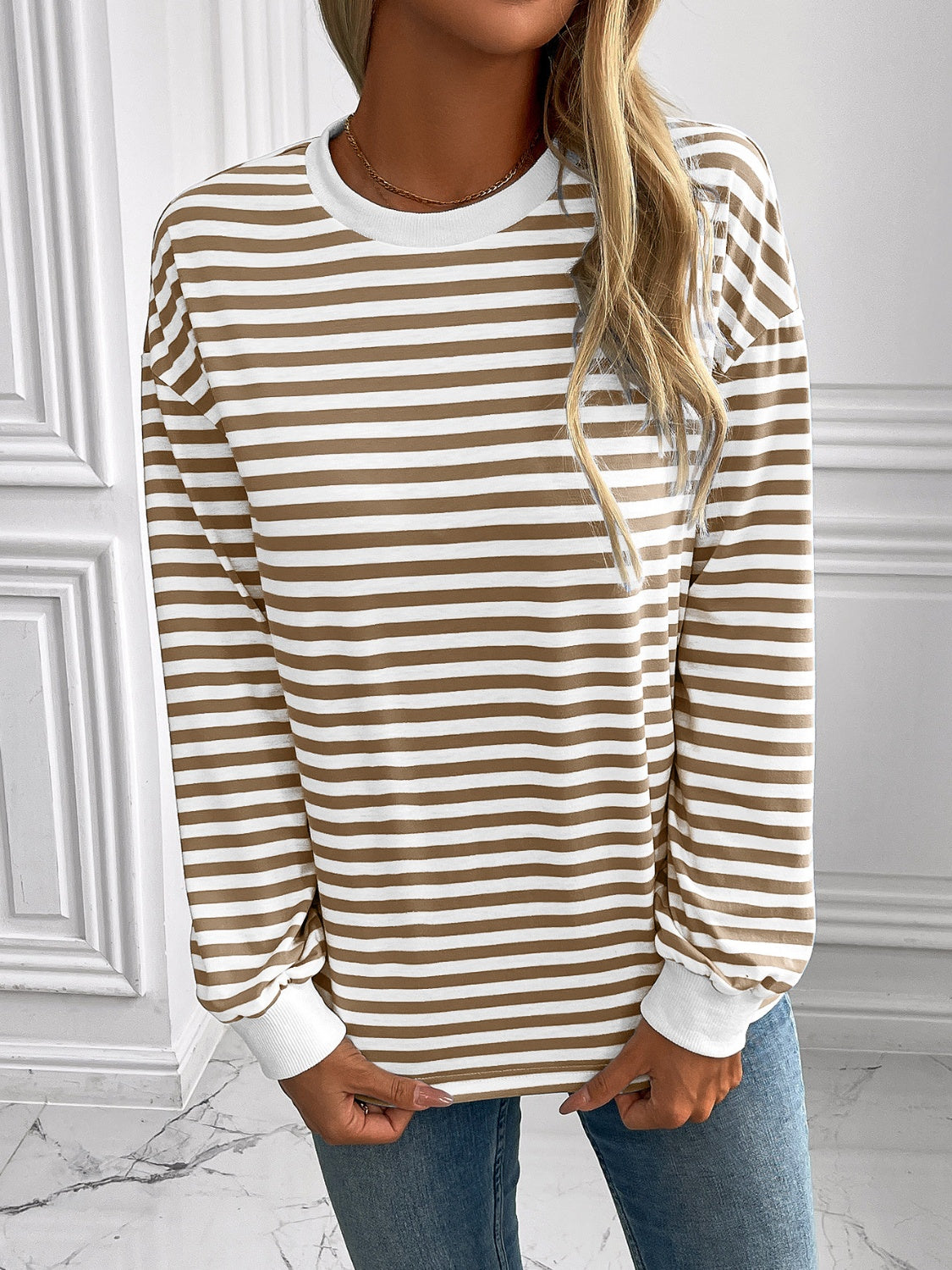Horizontal stripe crewneck sweatshirt with white cuffs and crew neck.