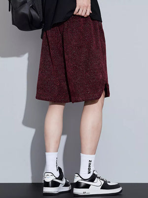 Burgundy textured boxer shorts with a drawstring and side slits.