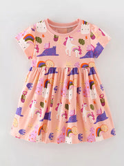 Toddler pink cotton dress with short sleeves and a whimsical unicorn, cat, and sun print.