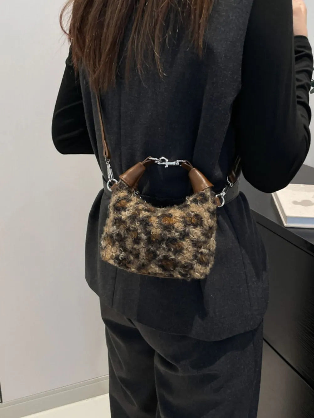 Shearling check mini shoulder bag with brown leather handles and silver hardware.