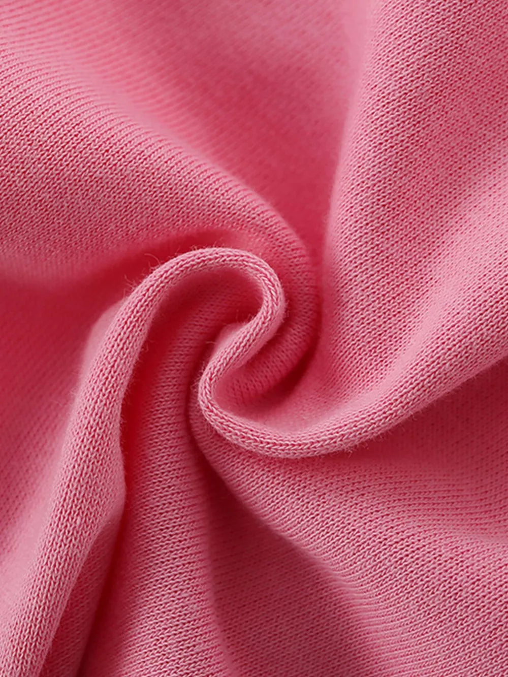 Pink cotton knit fabric detail of girls' underwear set.