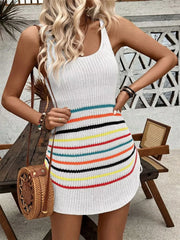 White knit dress with colorful horizontal stripes and adjustable side ties.