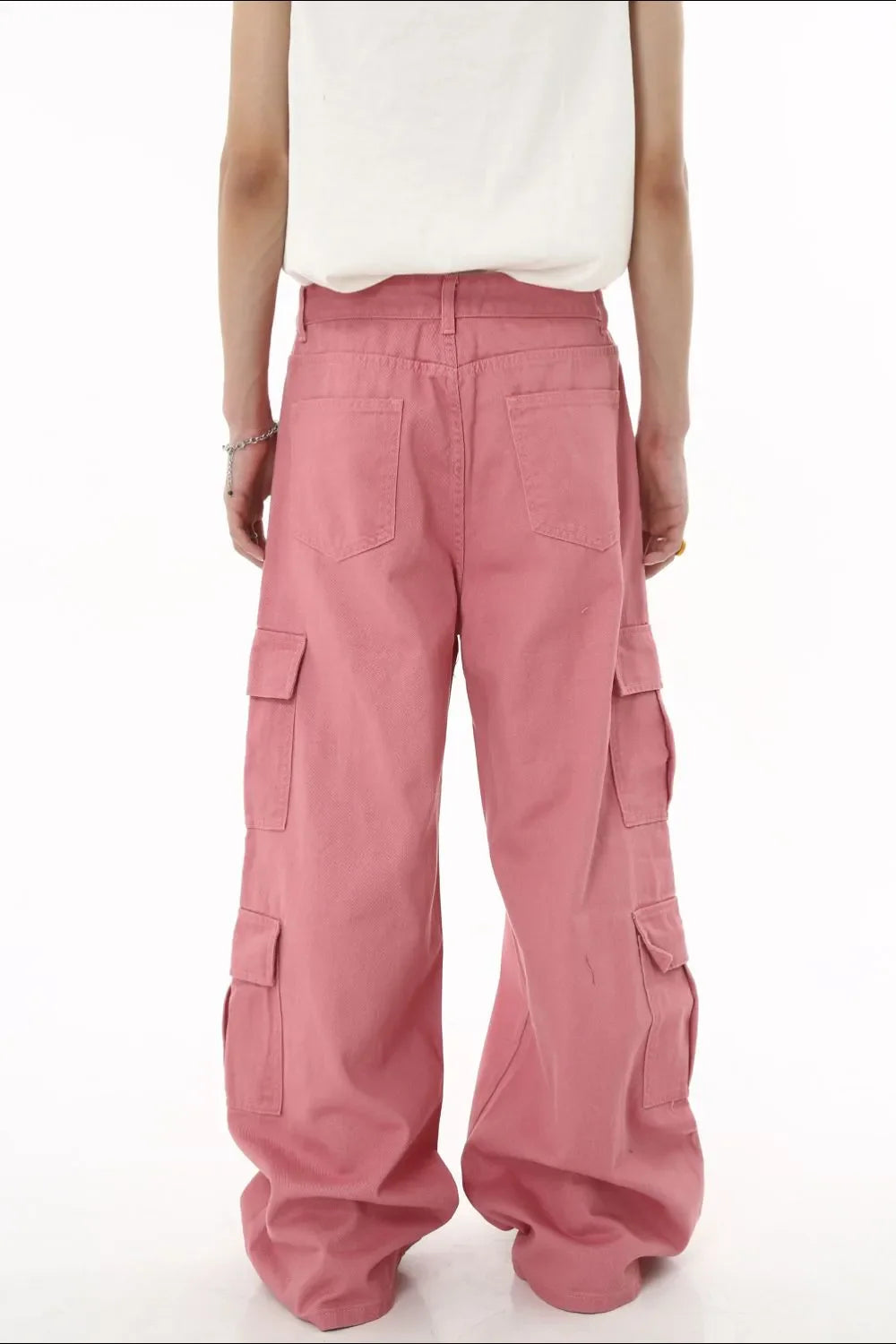 Oversized dusty pink cargo palazzo pants with button front and multiple pockets.