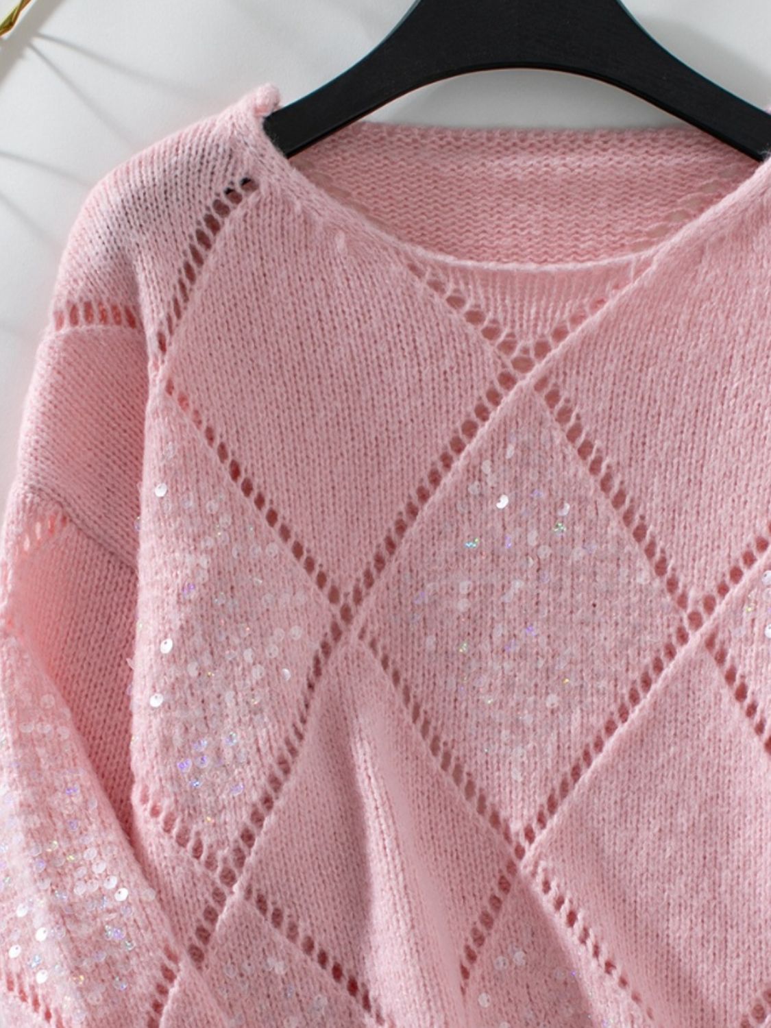 Dusty Pink diamond knit sweater with sequin detail and open knit accents.