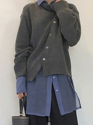 Dark Gray asymmetric button-up knit cardigan with silver buttons, worn over a blue collared shirt.