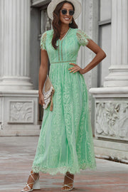 Mid green lace midi dress with scalloped hem and short sleeves.