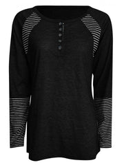 Black raglan stripe henley tee with button placket and striped cuffs.