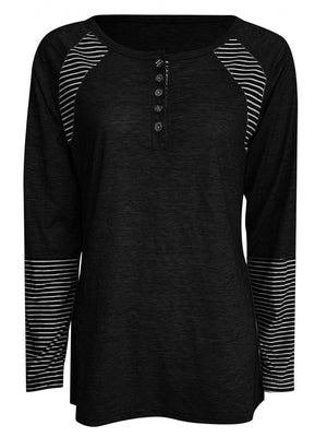 Black raglan stripe henley tee with button placket and striped cuffs.
