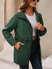 Dark green hooded windbreaker jacket with ruffled waistline and zippered pockets.