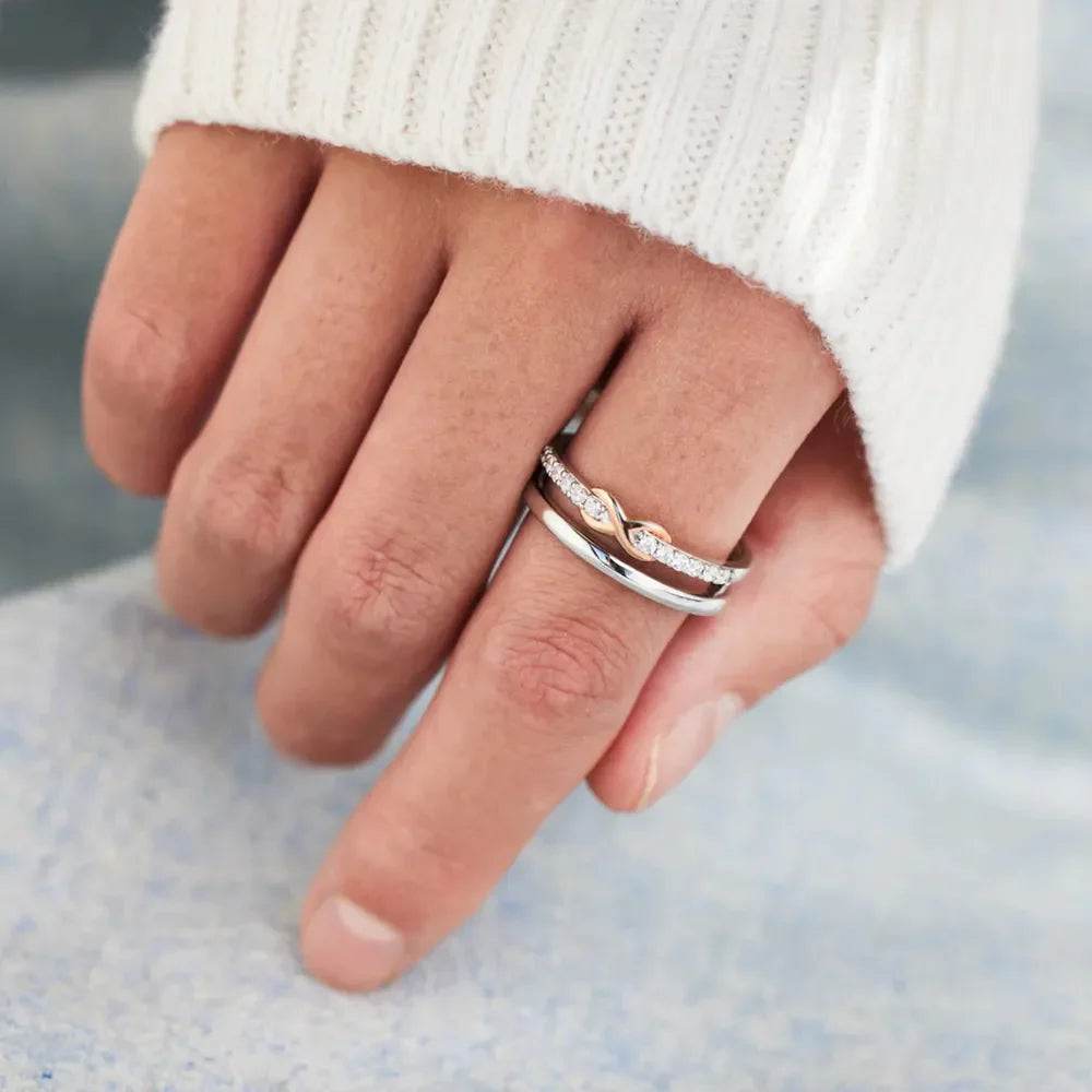 Silver infinity knot trio ring set with pave diamonds on one band