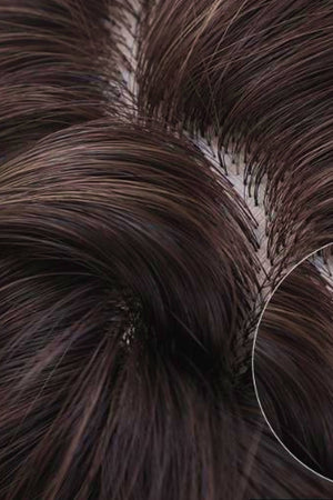 Ombre beach wave wig in light brown/blonde balayage, showing close-up of root detail.