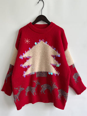 Red acrylic sweater with Christmas tree and reindeer graphic, sequin trim.