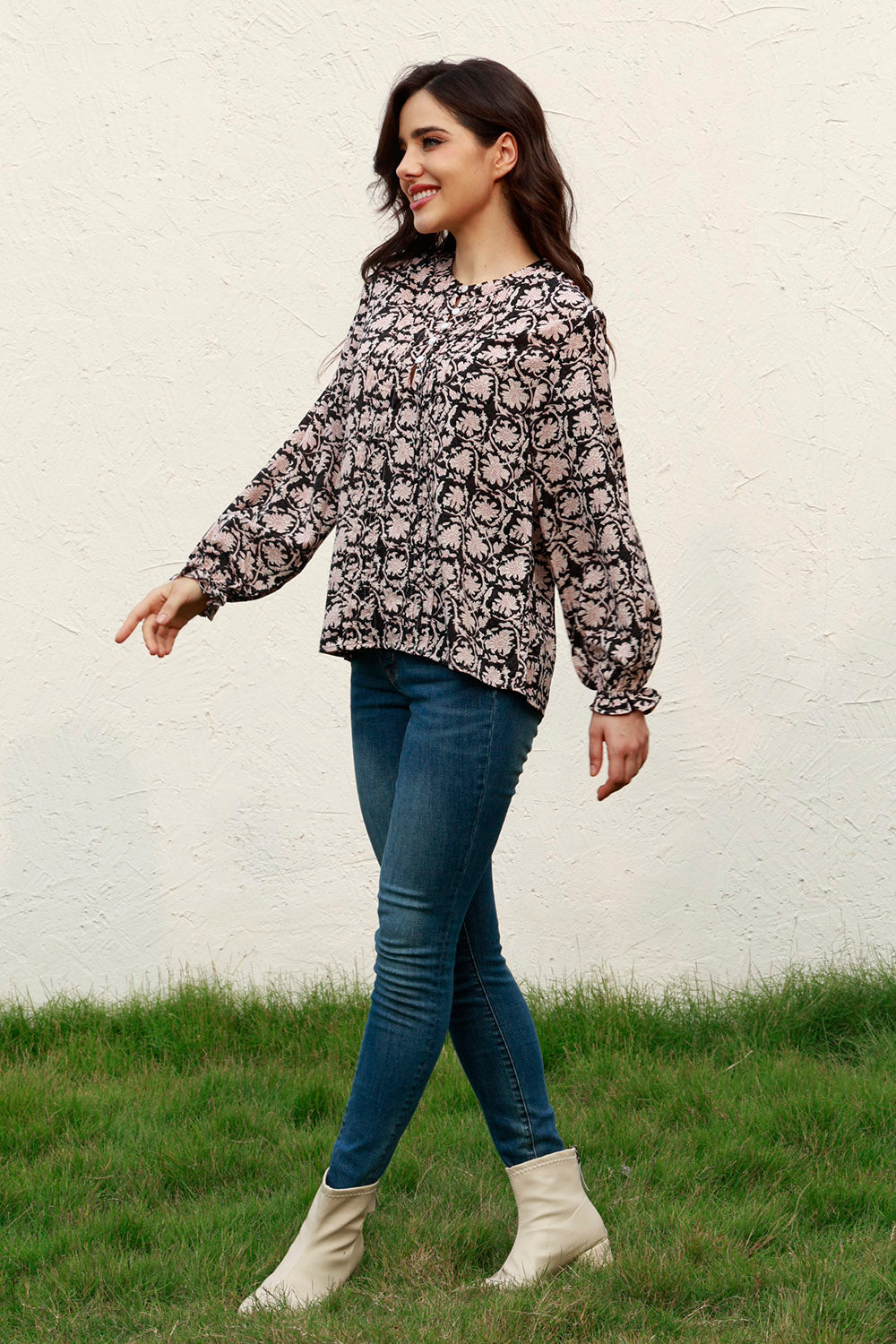 Black floral print blouse with keyhole neckline and ruffle cuffs
