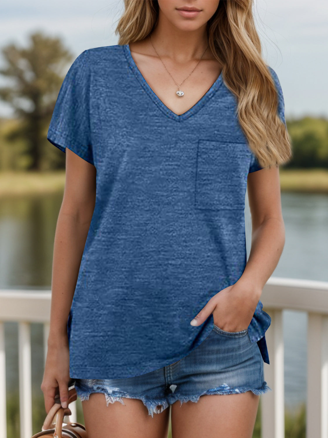 Dusty Blue V-neck tee with short sleeves, chest pocket, and slit hem.