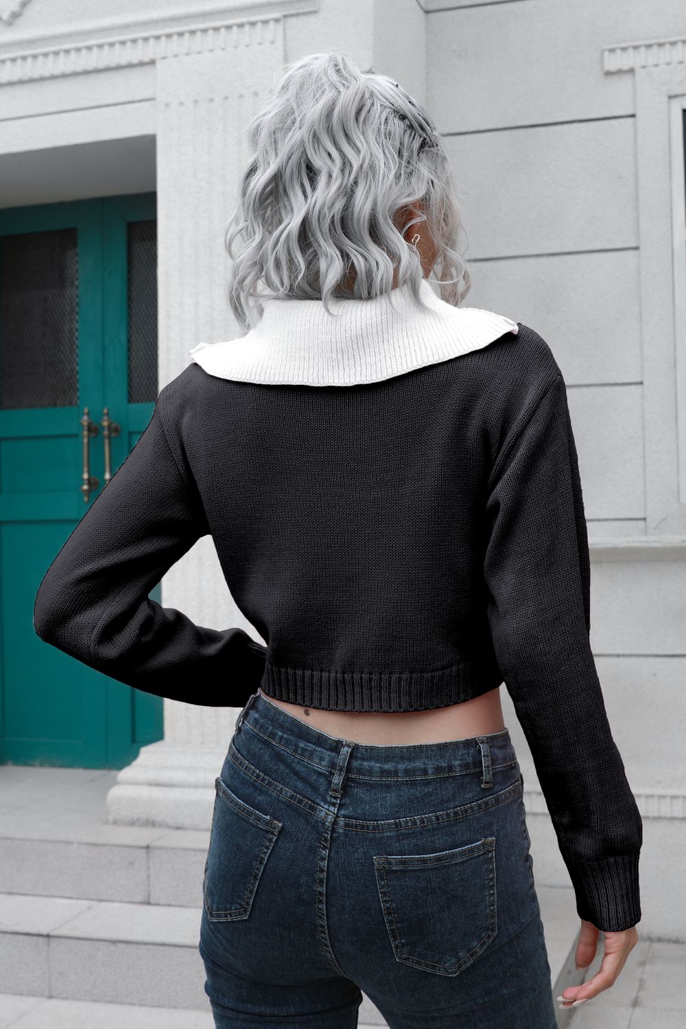 Black cropped acrylic sweater with white collar and zip detail