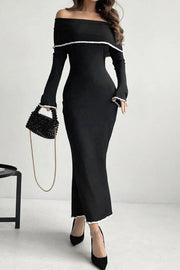 Black off-shoulder maxi dress with ruffled trim and long sleeves.