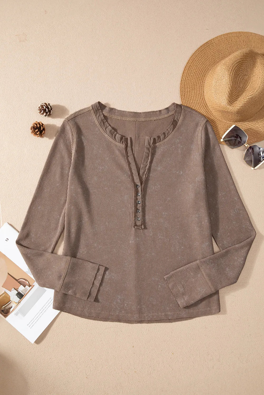 Taupe waffle knit henley blouse with button detail and notch neckline.