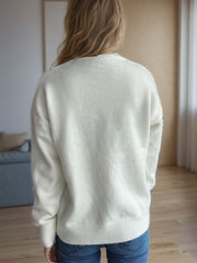 Cream textured knit crew neck pullover sweater with ribbed cuffs and hem