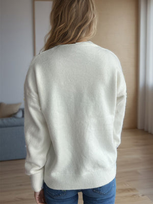 Cream textured knit crew neck pullover sweater with ribbed cuffs and hem