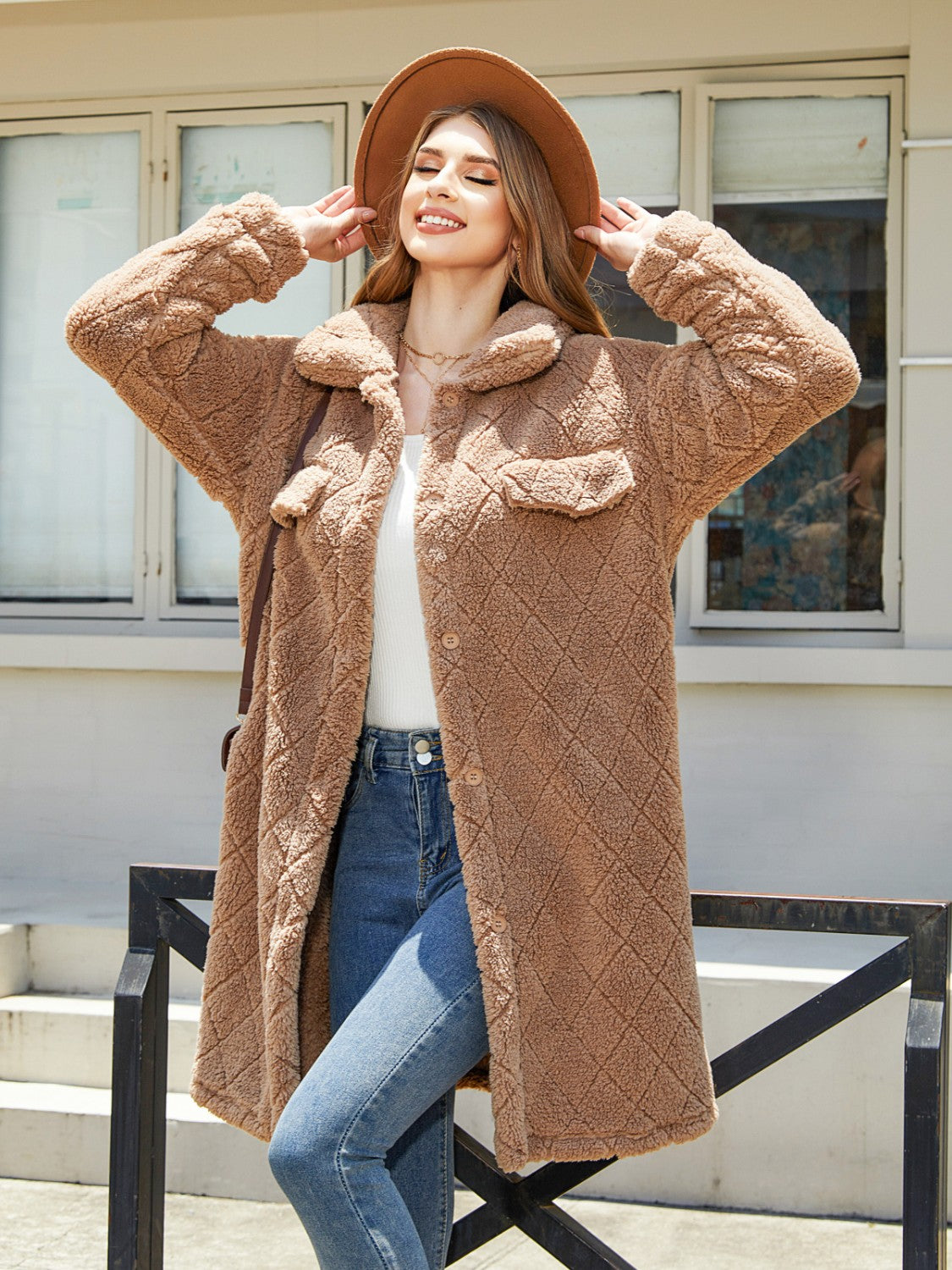 Camel quilted teddy bear coat with patch pockets and button front.
