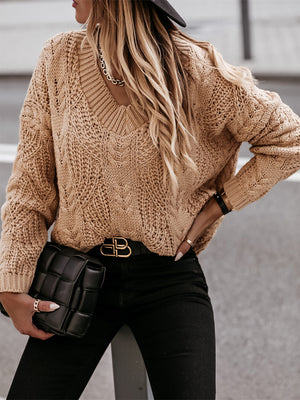 Khaki cable knit v-neck sweater with relaxed fit and textured pattern.