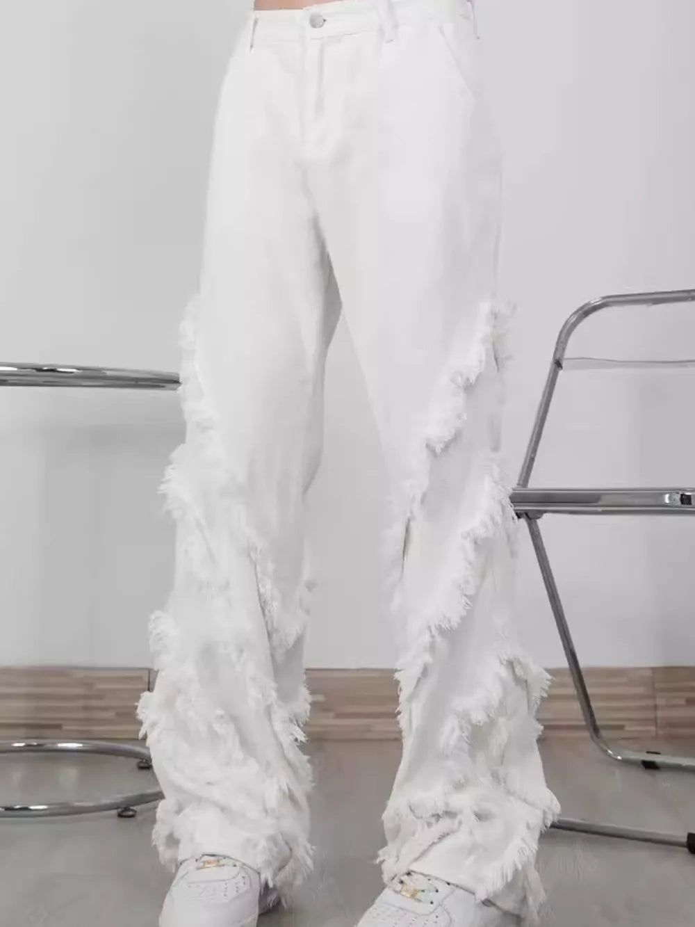 White wide-leg jeans for men with fringe trim detail.